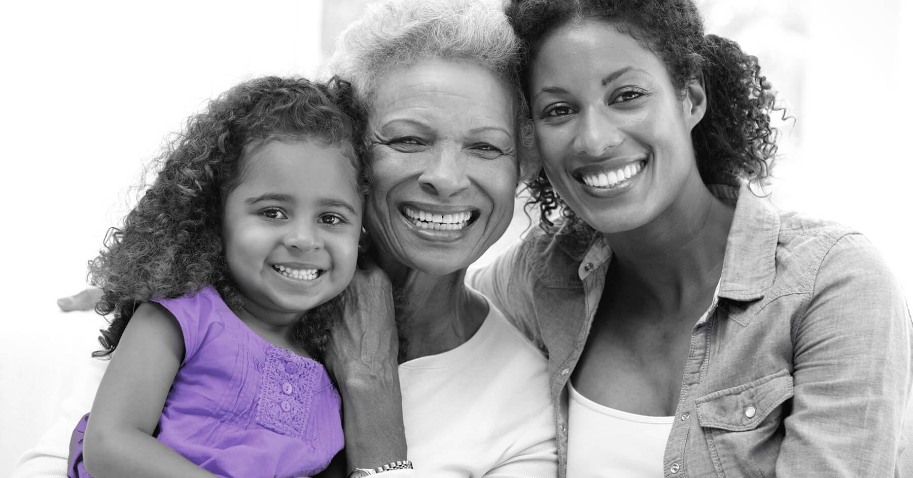 Mother, daughter and grand-daughter smiling