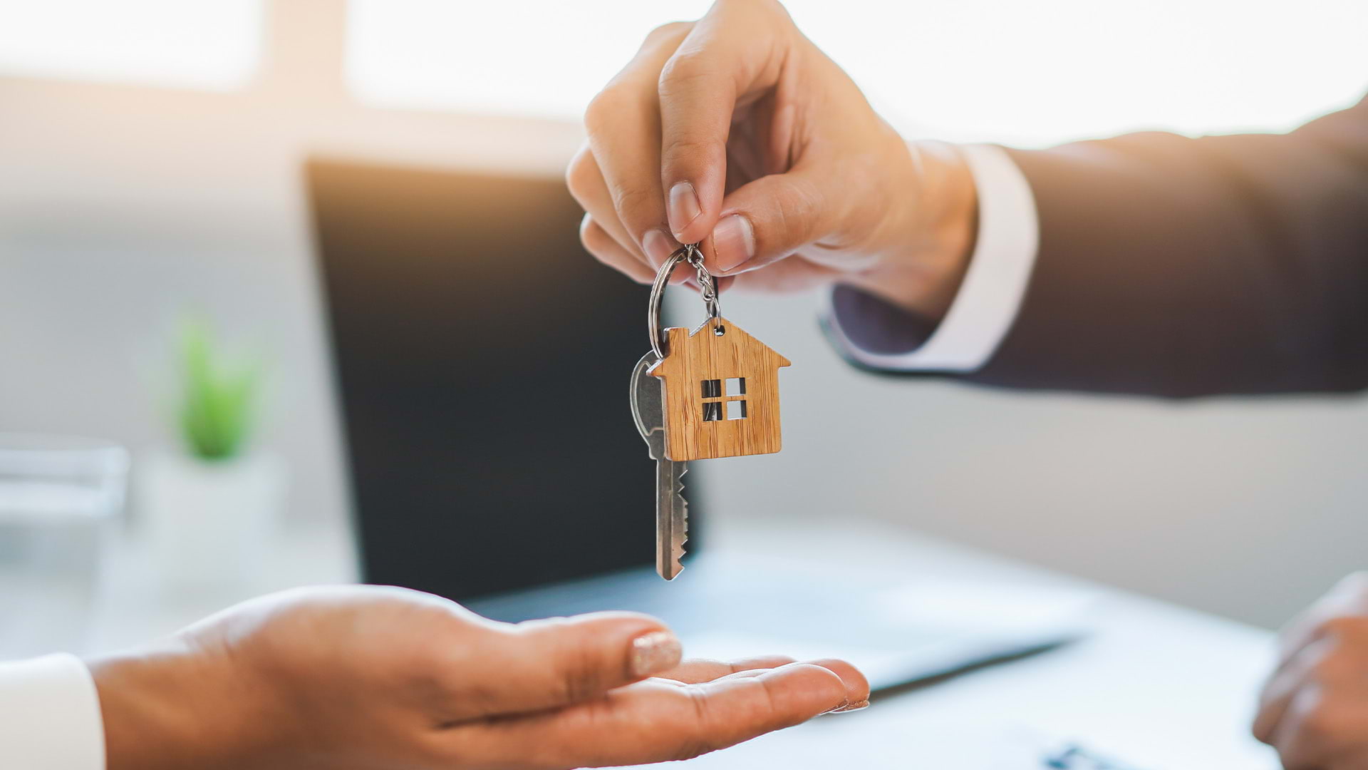 Bank handing over keys to a new home owner.